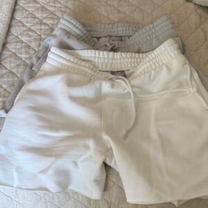 Aritzia TNA CozyAF two pairs white and Gray Fleece Shorts excellent condition M
